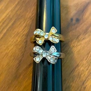 2 rings. Silver and gold bows. Both size 6.5